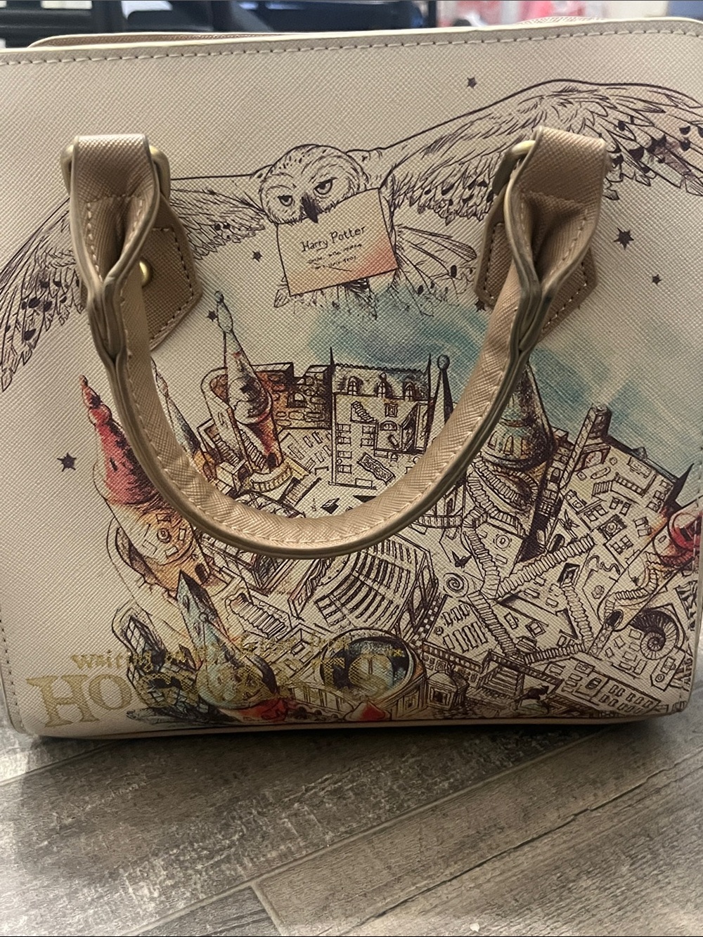 Warner Bros. Beige and Gold Illustrated Dome Satchel with Muted Accent Colors